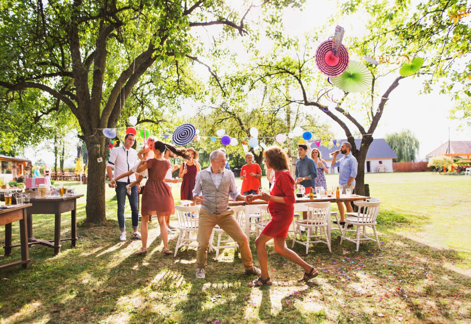 Outdoor party with people dancing and celebrating.