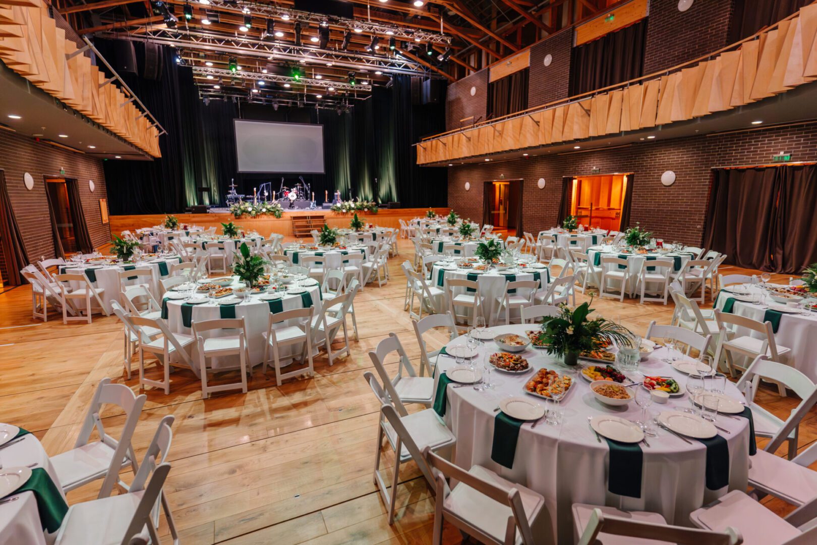 Banquet hall with round dining tables set.