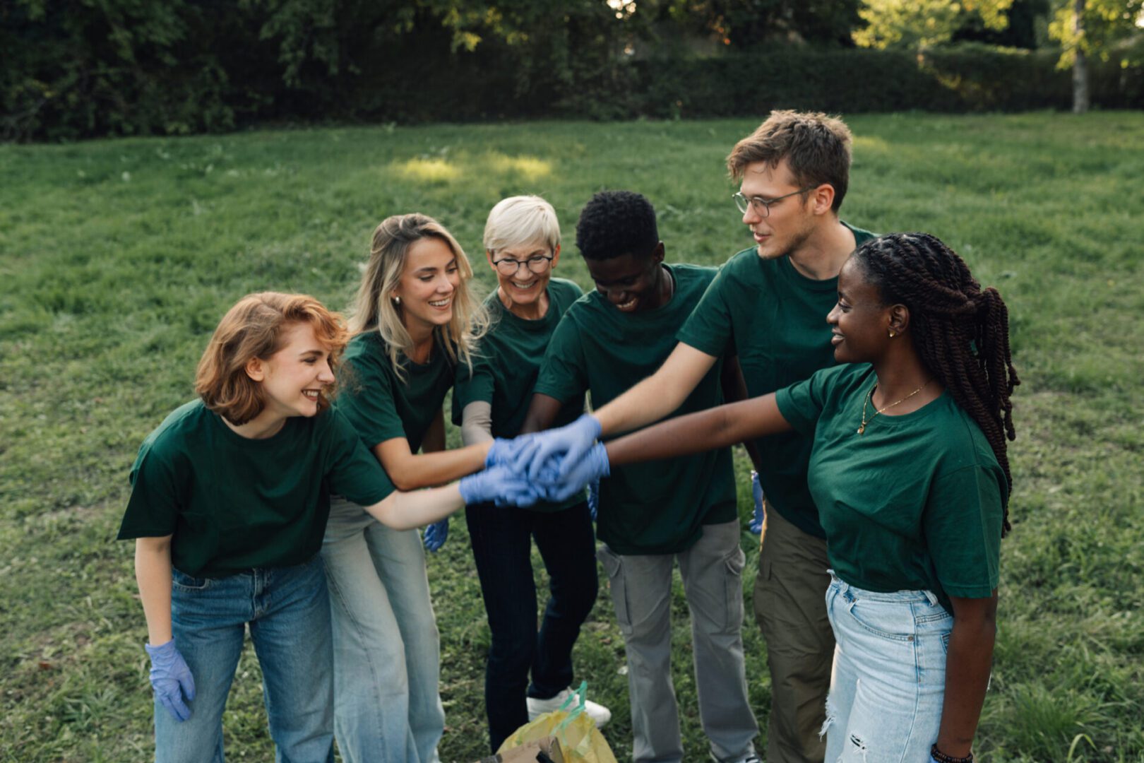 Group of people volunteering in a park.