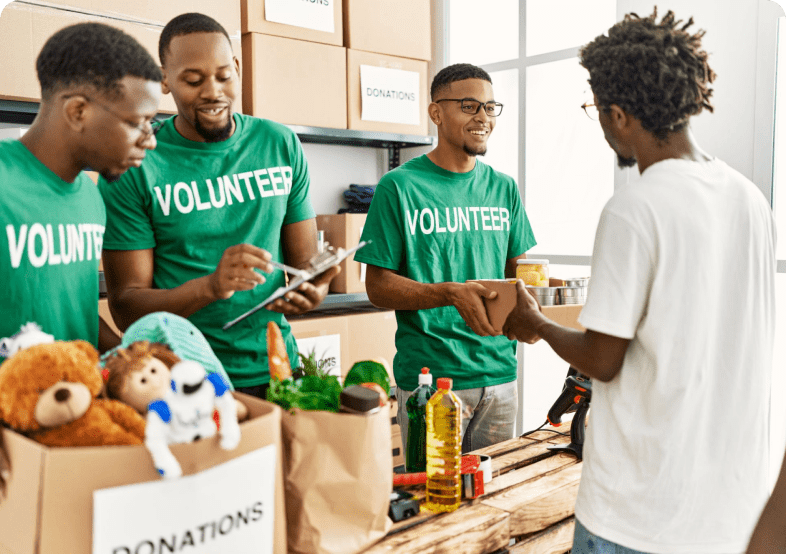 Volunteers organizing donations at community center.